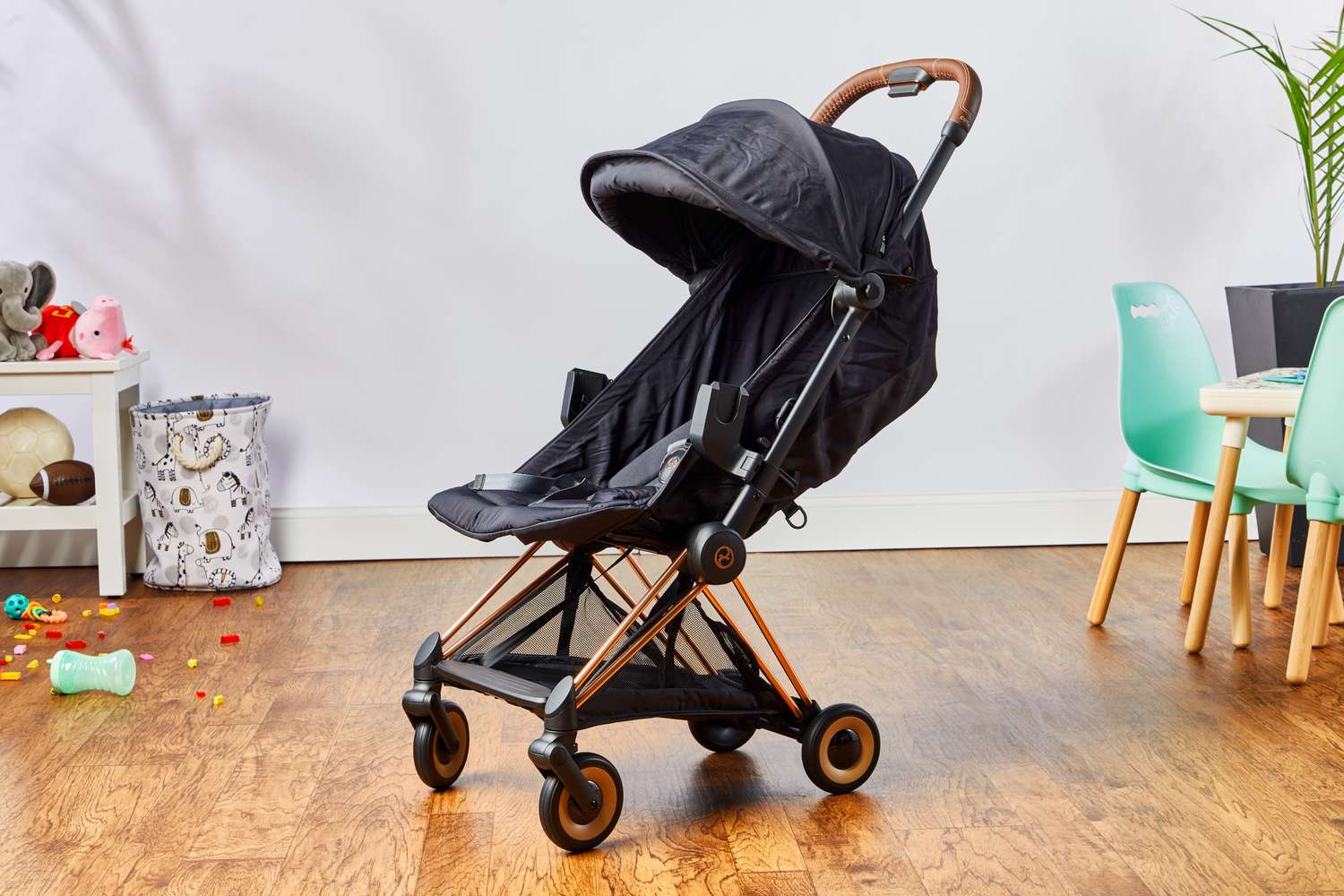 A CYBEX Coya stroller placed in the middle of a nursery.
