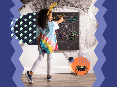 Girl doing spider crafts