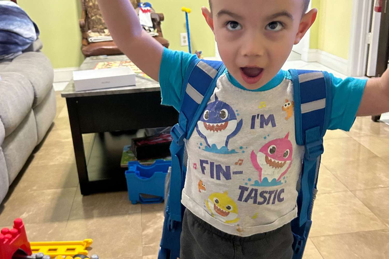 Kid wearing JWorld Sunrise Rolling Backpack