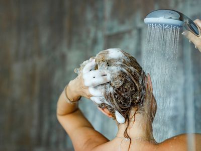woman using shampoo