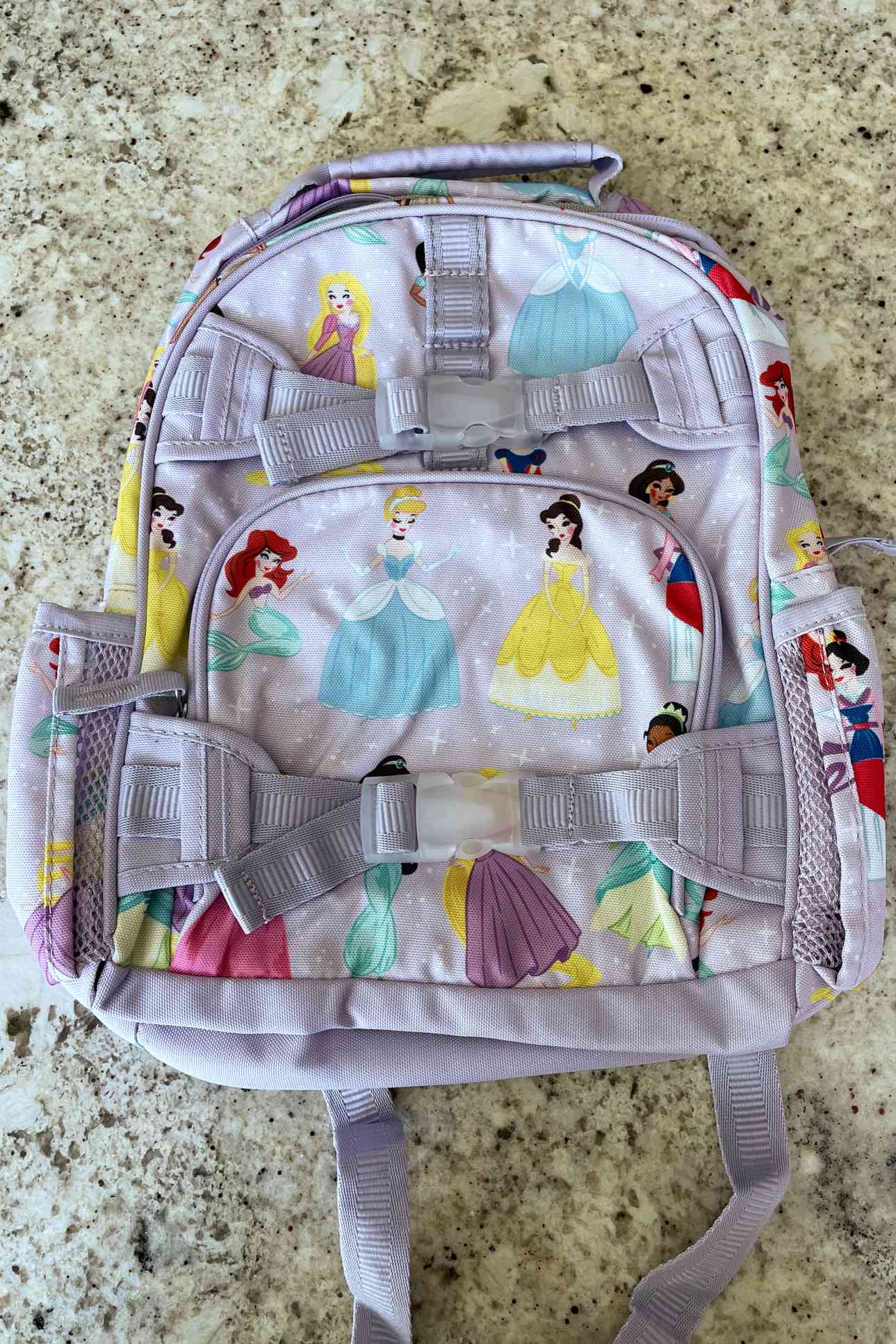 Pottery Barn Kids Mini Glow-in-the-Dark Mackenzie Backpack displayed on floor