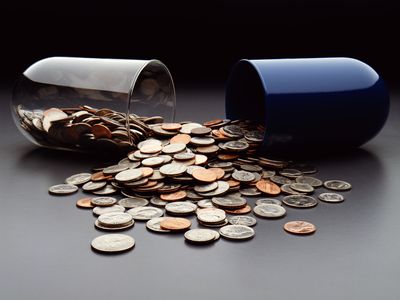 Oversize pill with coins inside