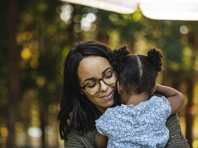 mom hugging daughter
