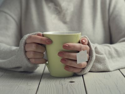 person holding tea