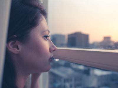 Woman looking out the window