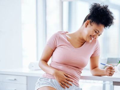 young woman taking a pregnancy test