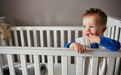 toddler awake in crib