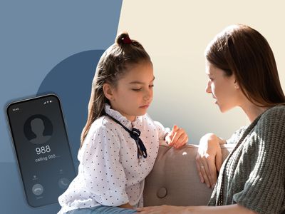 A phone with 988 (suicide hotline) and a woman with a smaller child