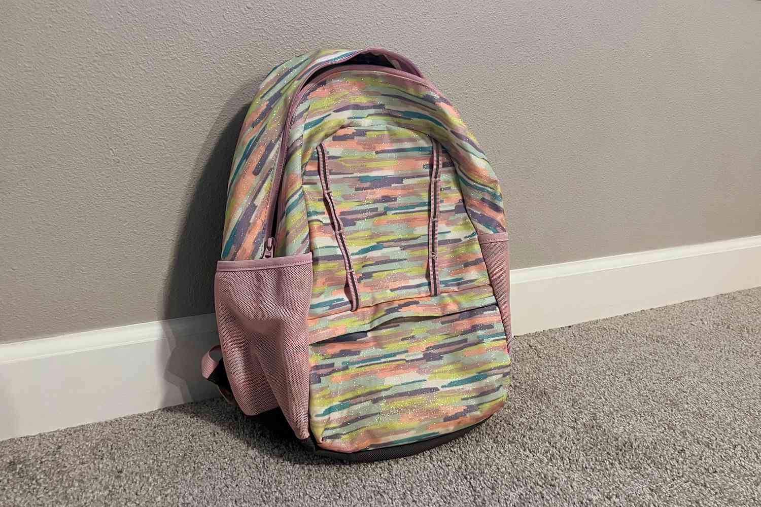 Lands End Kids ClassMate Small Backpack displayed on carpet floor in-front of wall