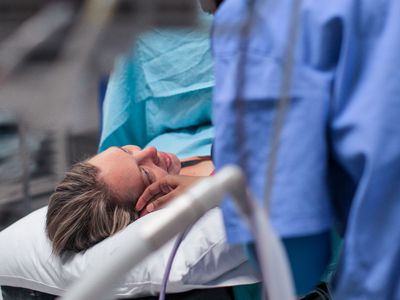 Person giving birth.