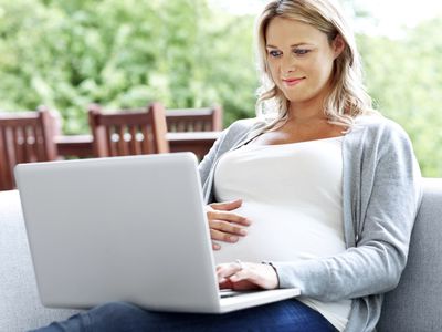 pregnant woman on laptop