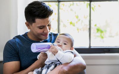 bipoc-man-babysitting-baby