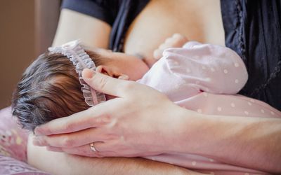 Parent breastfeeding their baby