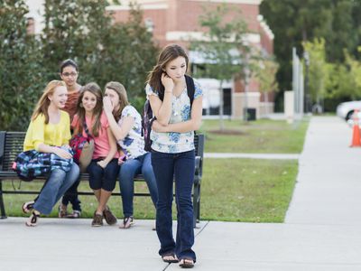 Girl being teased by other girls