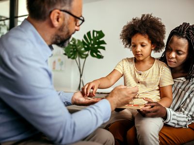 Mother and daughter in a therapy session with a psychologist