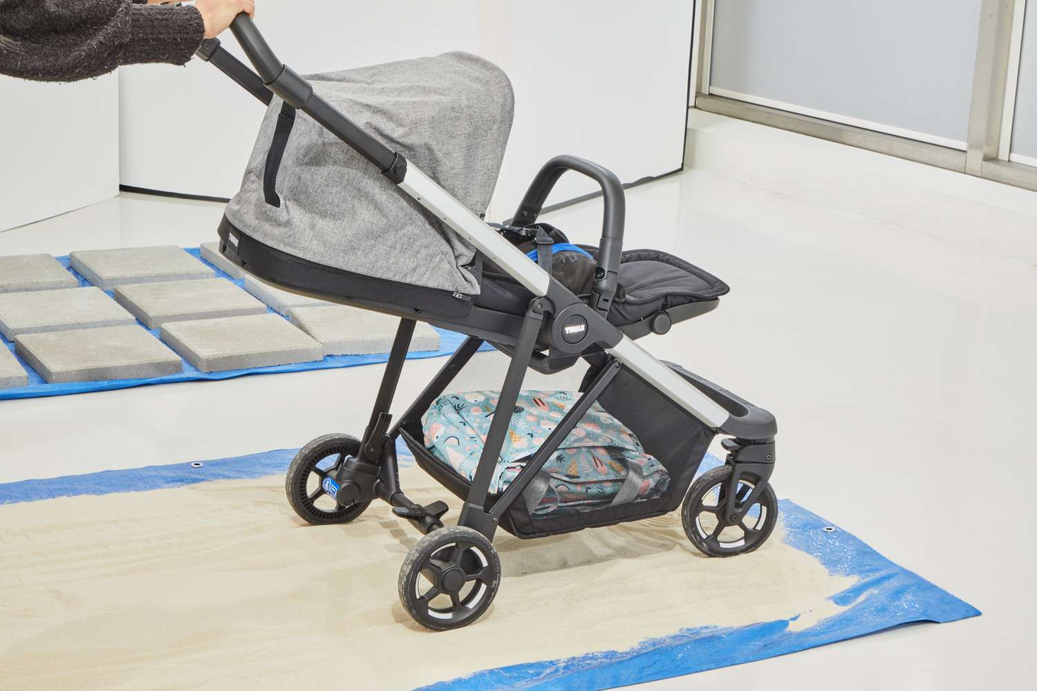 Testing the maneuverability of the Thule Shine running stroller on sand