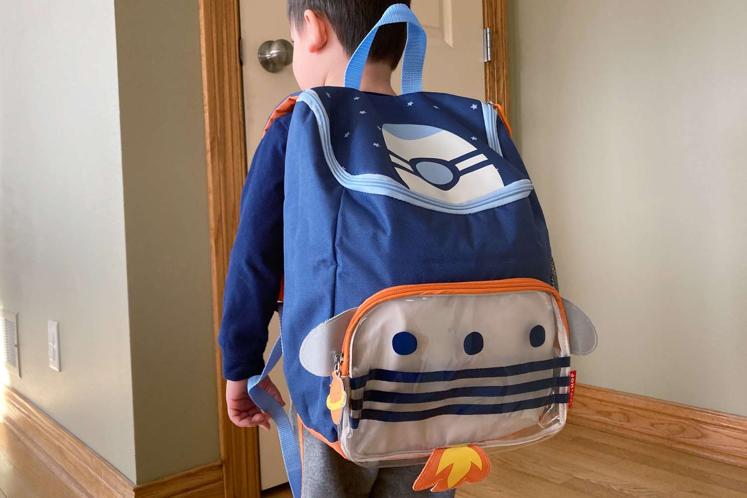 Person wearing Skip Hop Spark backpack