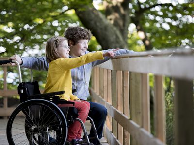 Boy and disabled girl at the park