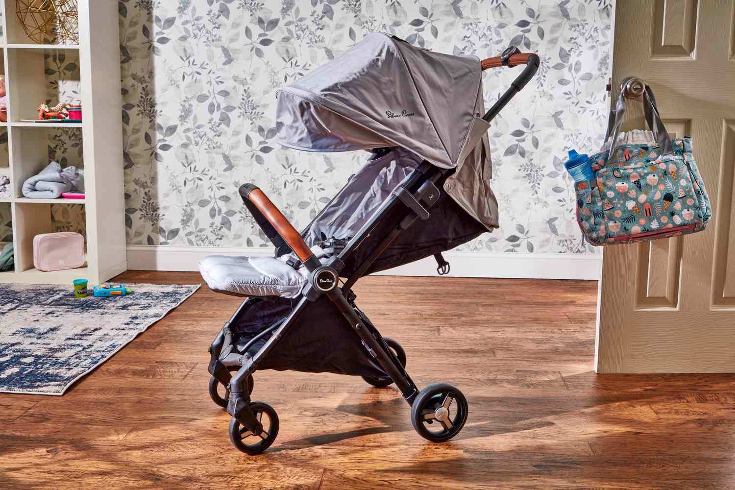 的Silver Cross Jet 3 Super Compact Stroller displayed in a room
