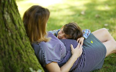 A picture of a pregnant woman holding her son