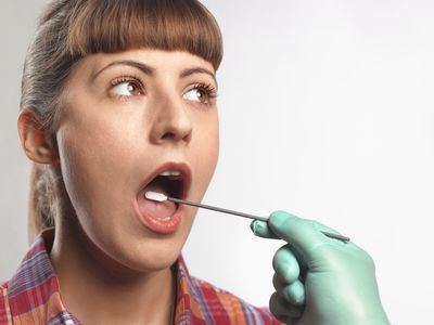 Woman getting swabbed for DNA test