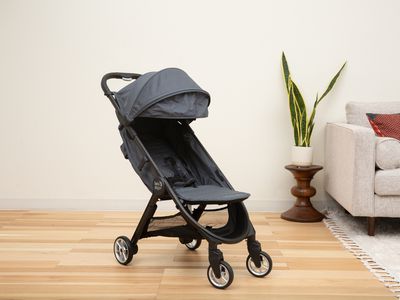 Baby Jogger City Tour 2 Stroller displayed on a wood floor in a living room
