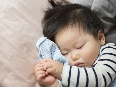 baby sleeping with blanket