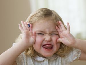 Young girl making faces