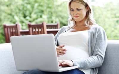 pregnant woman on laptop