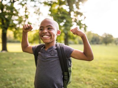 Child flexing muscles